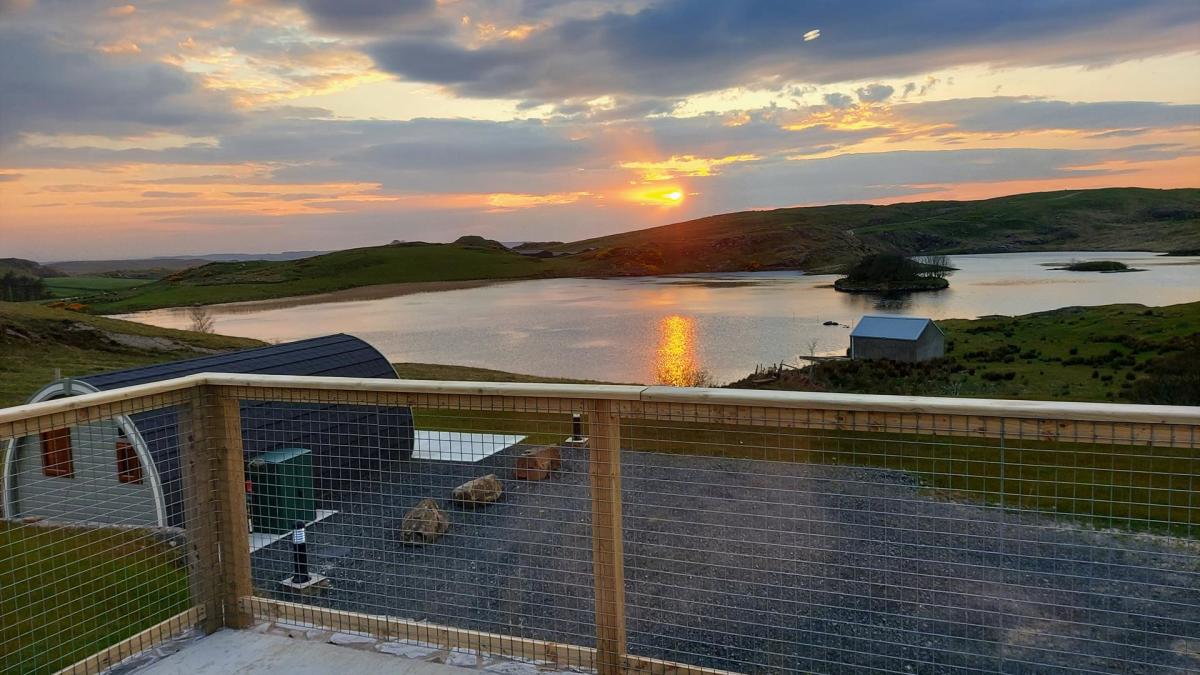 Glamping pods overlooking a lake in County Antrim, Northern Ireland