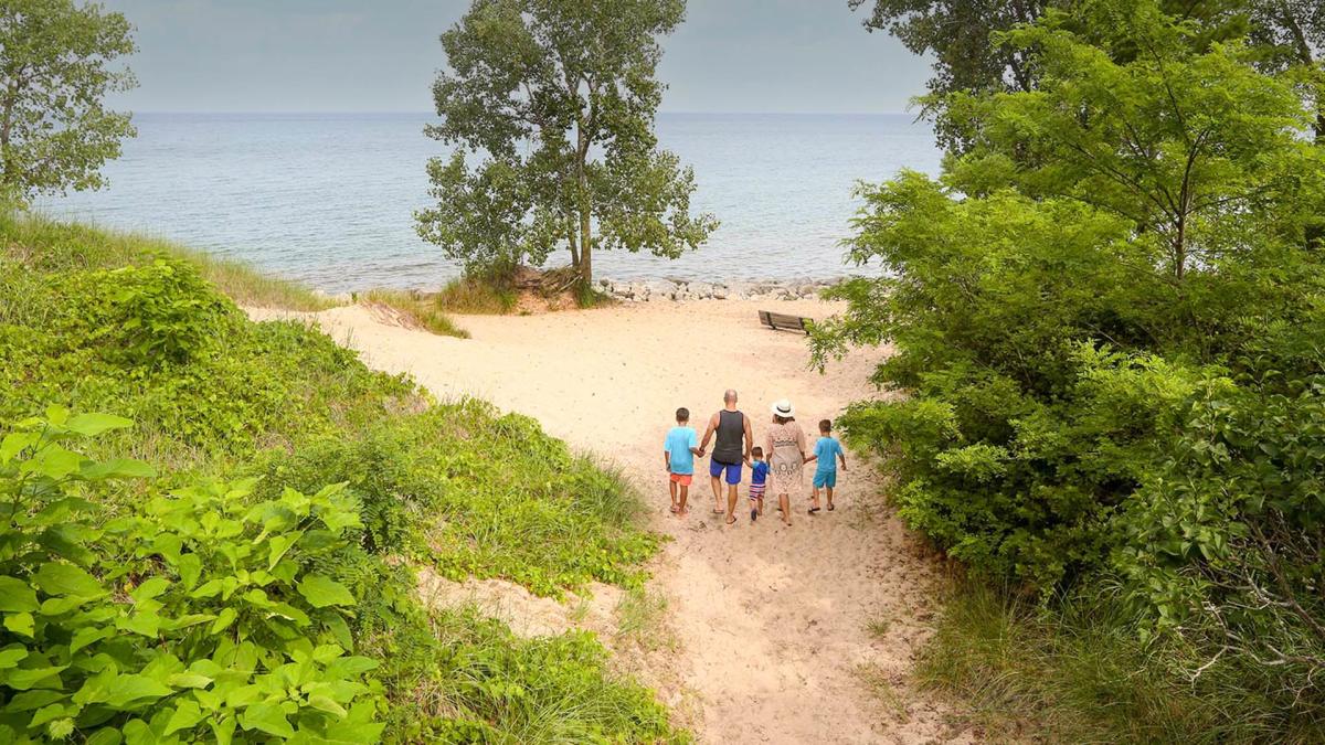 Family walking to Indiana Dunes beach