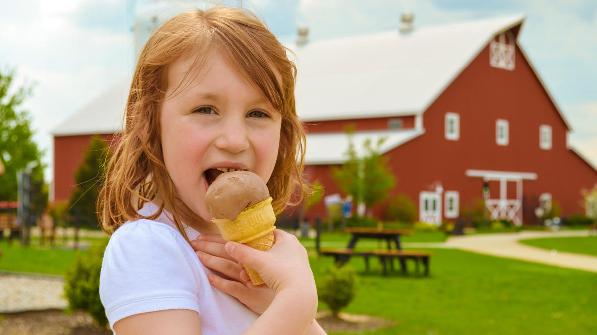 Girl eating ice cream at Fair Oaks Farms