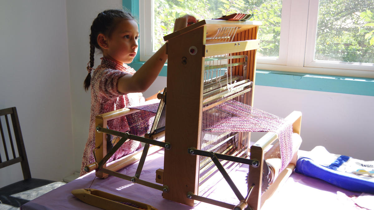 Art Barn - child weaving at Art Blitz