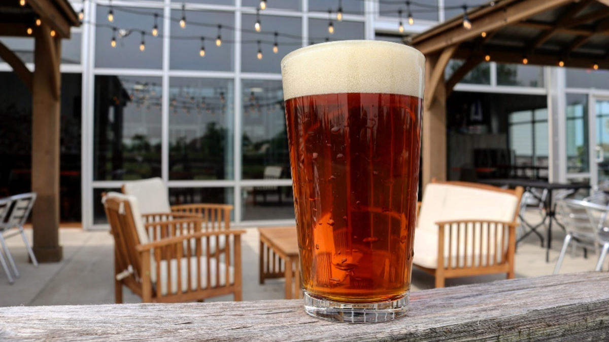 A pint of beer on a table outdoors at Byway Brewing patio