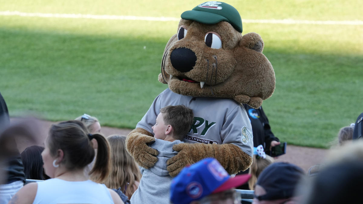 Kid with Rusty at RailCats game