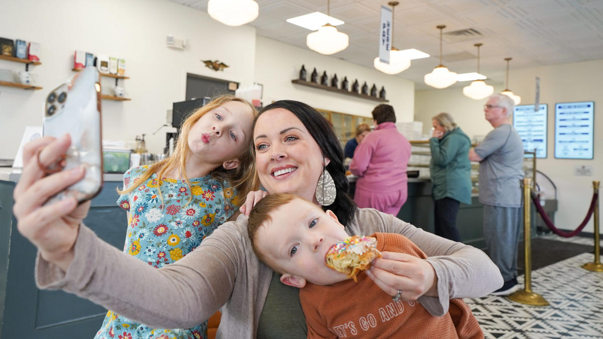 Mom and kids taking selfie at Parlor Doughnuts