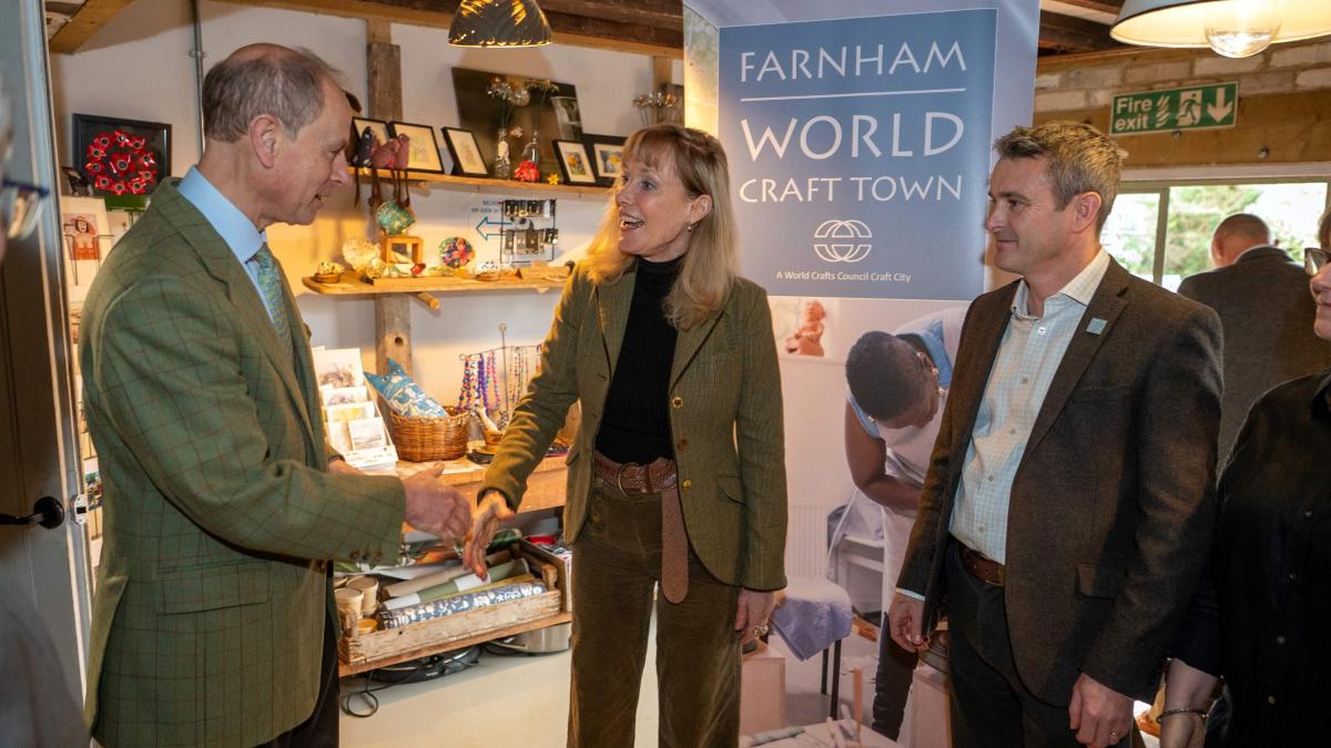 HRH Duke of Edinburgh discusses Farnham World Craft Town with Cllr Kika Mirylees and Oliver Cluskey of Farnham Town Council