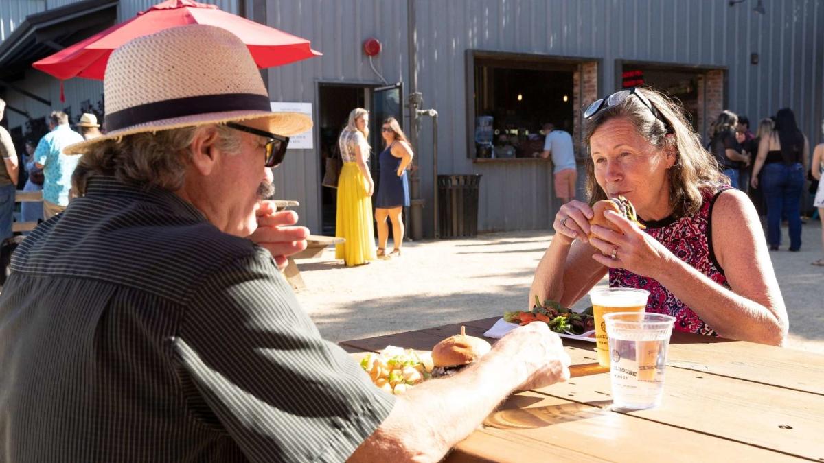 Couple Dining Outside at Tin City