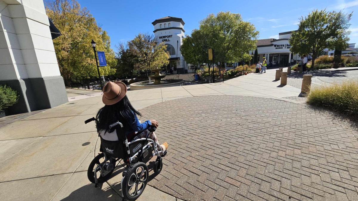 Ms. Wheelchair America explores the outdoor shopping center Bradley Fair
