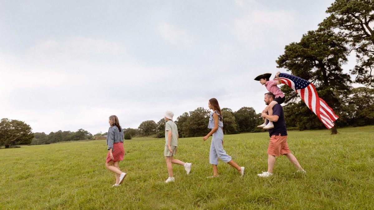 Family on Yorktown Battlefield with Flag Header