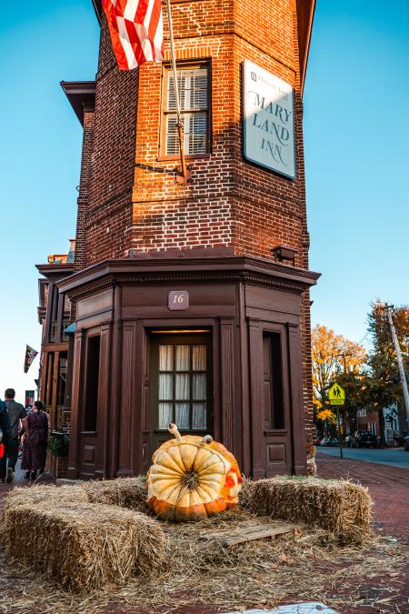 a giant jack o lantern in front of the historic Maryland Inn