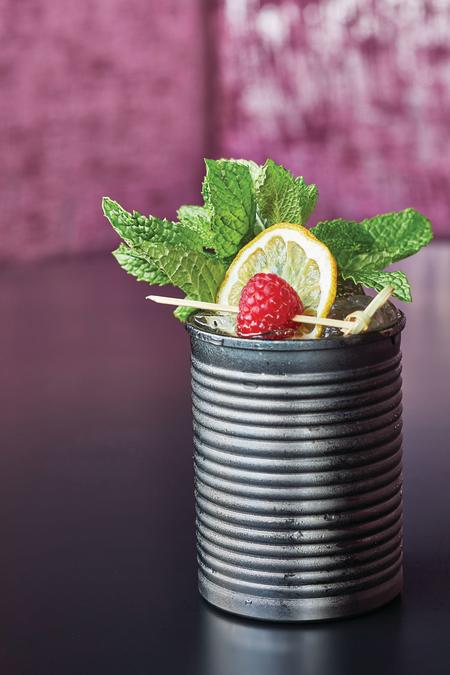 Cocktail the "Viva" in served in a metal can with fresh mint, lemon, and raspberry at WXYZ Bar at Aloft Hamilton Place