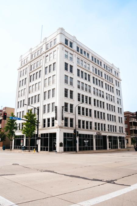 Tall white building with lots of windows. Bellin Building in Downtown Green Bay.