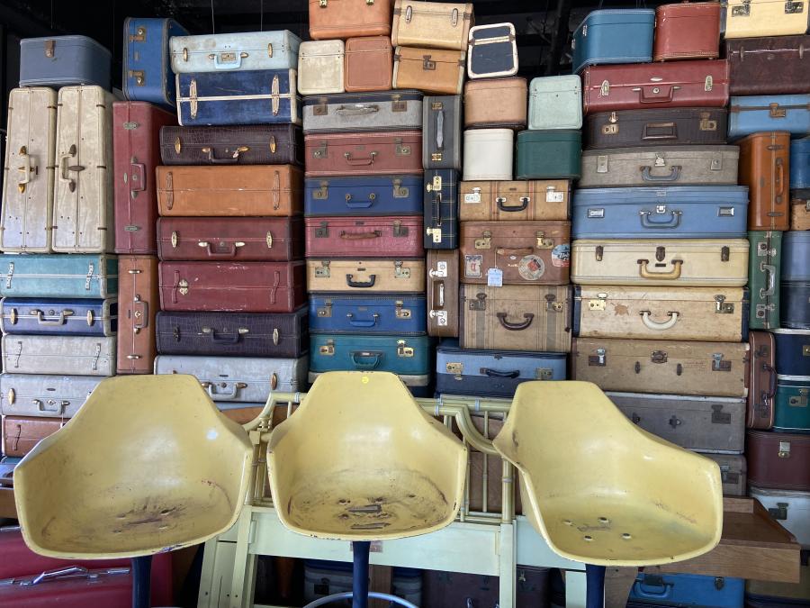 Antique Chairs And Suitcases 