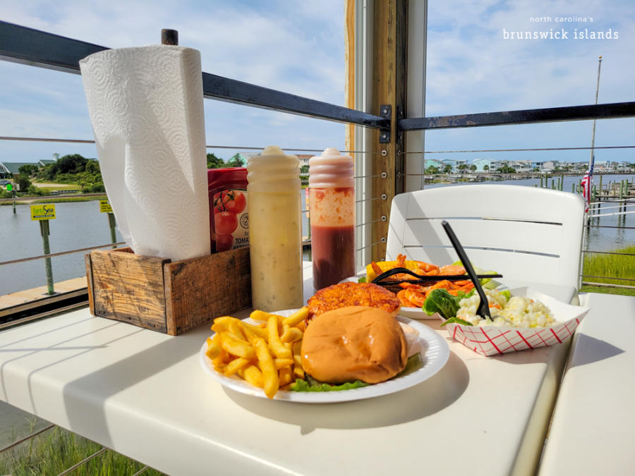 A plate of food at a waterfront restaurant