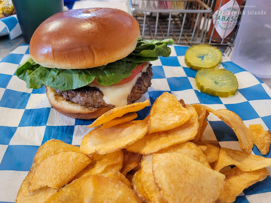 a hamburger and side of chips from Blue Cow Grille in Southport