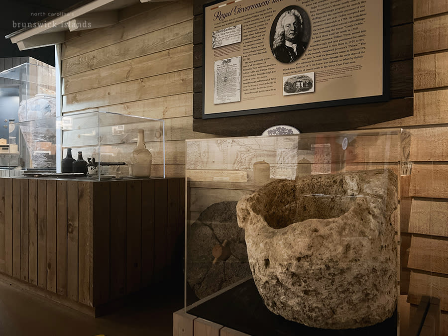 a history exhibit with colonial artifacts at a museum