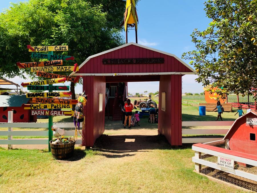 sign and red barn entrance at Tolmachoff Farms
