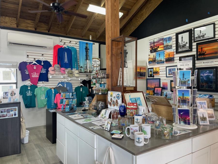 A display of artwork, tee-shirts, and small gift items