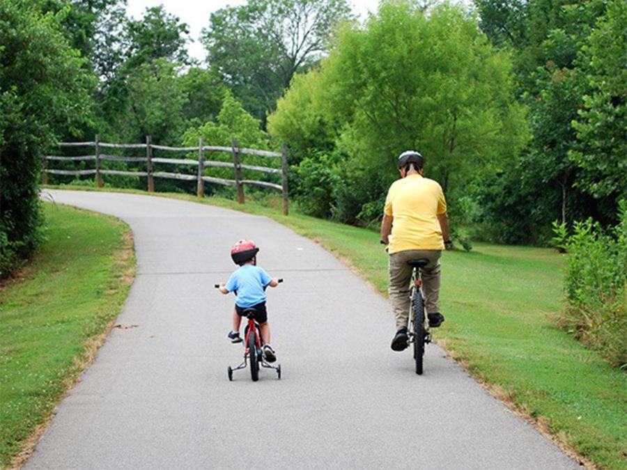 Dad and son biking at the Salisbury Greenway