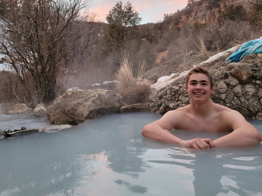 teenage boy in water at Fifth Water Hot Springs