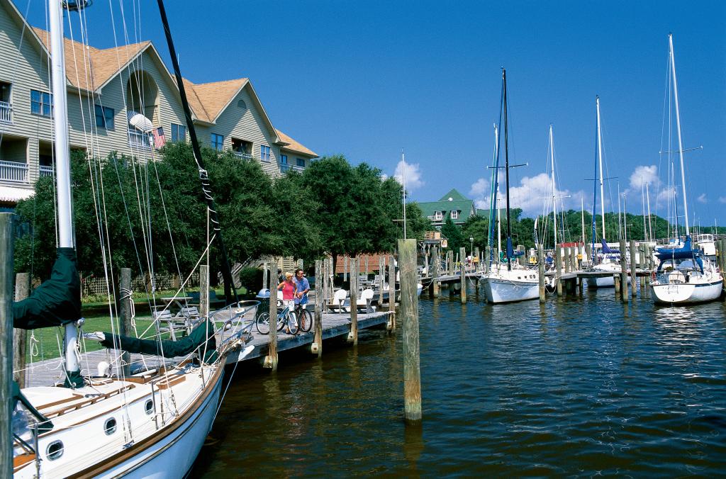 bikes at manteo waterfront sailboats