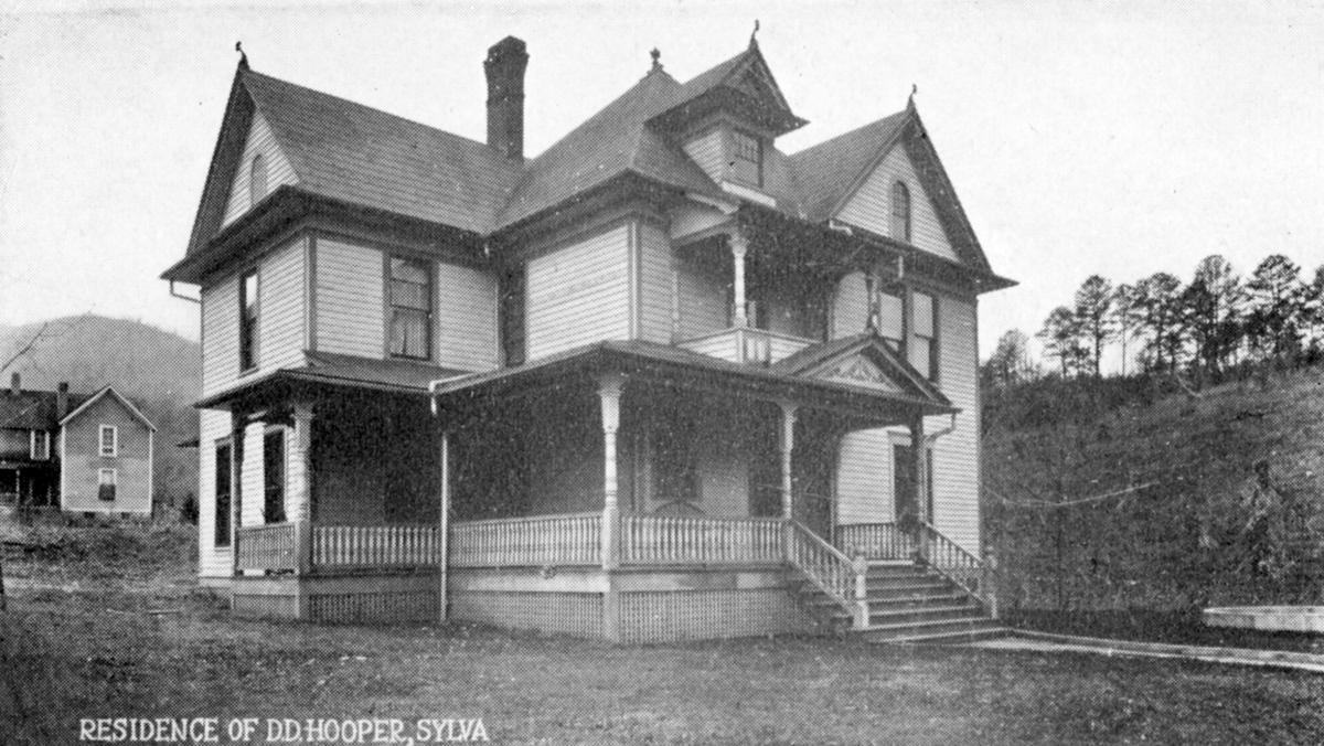 Early postcard of the Victorian residence of Dr. D.D. Hooper in Sylva, NC, with steep gables and a wraparound porch, now the Jackson County Visitor Center