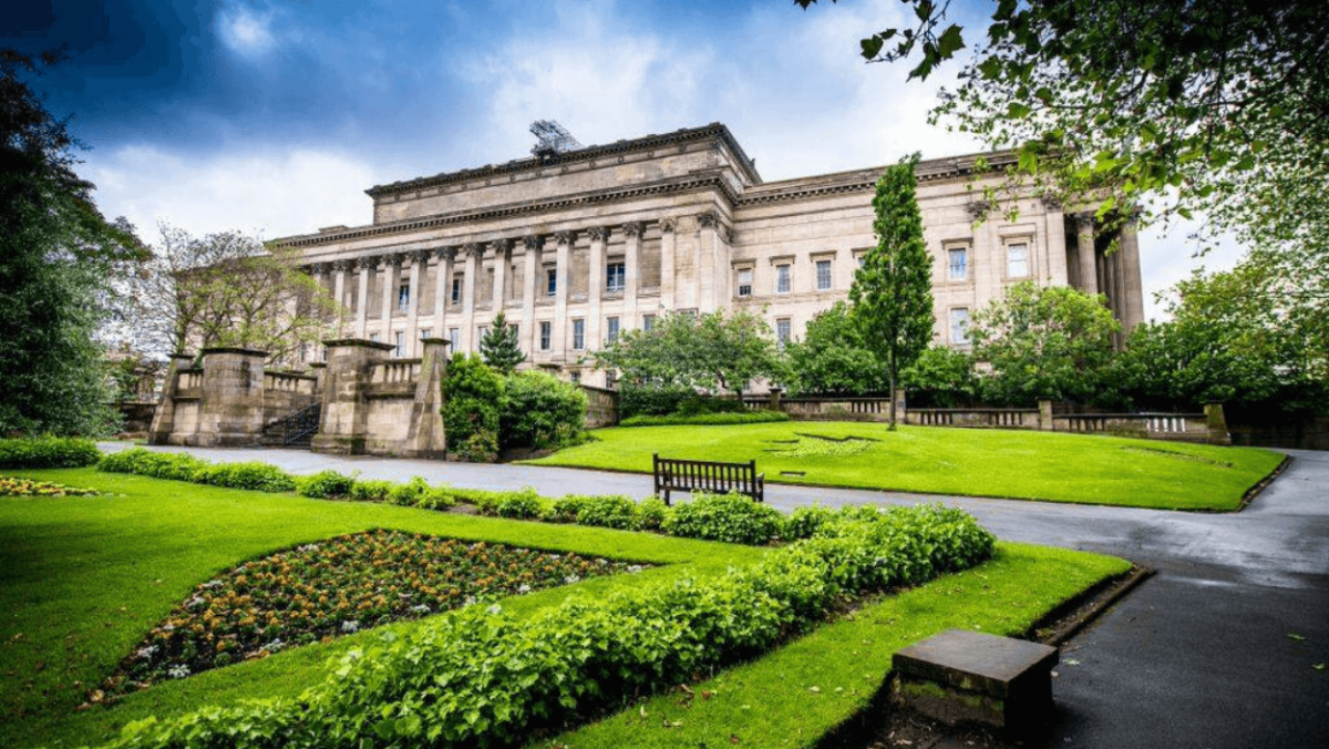The colossal St George's Hall, a neo-classical building complete with lush green gardens.