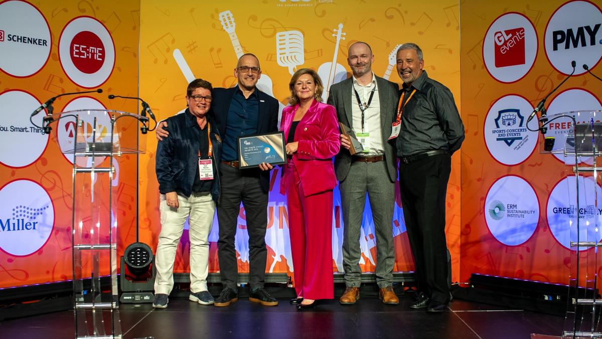 People on stage accepting an award