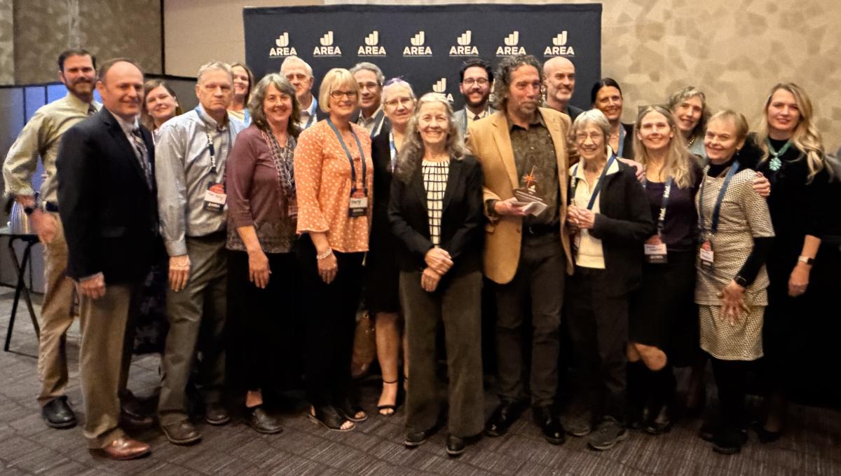 Visit Albuquerque President & CEO Tania Armenta (far right) poses with Bill Keleher (tan jacket) and his family members at the AREA 505 Awards, where Keleher was named Advocate of the Year.
