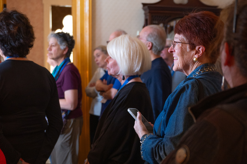 A group of visitors tour the interior of the Peel Museum