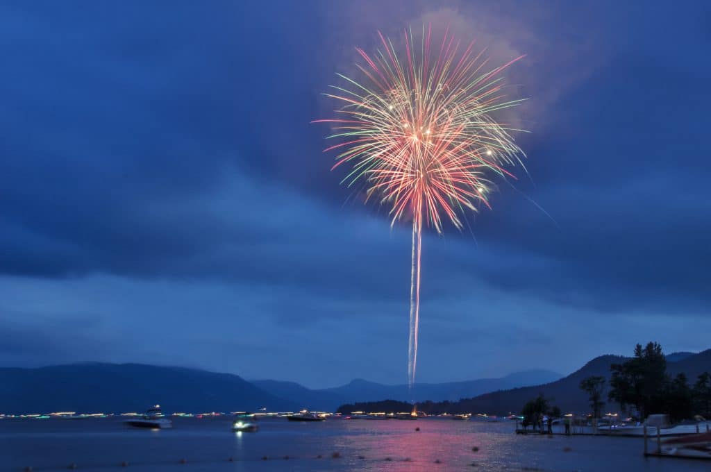 Fireworks at dusk over Lake George