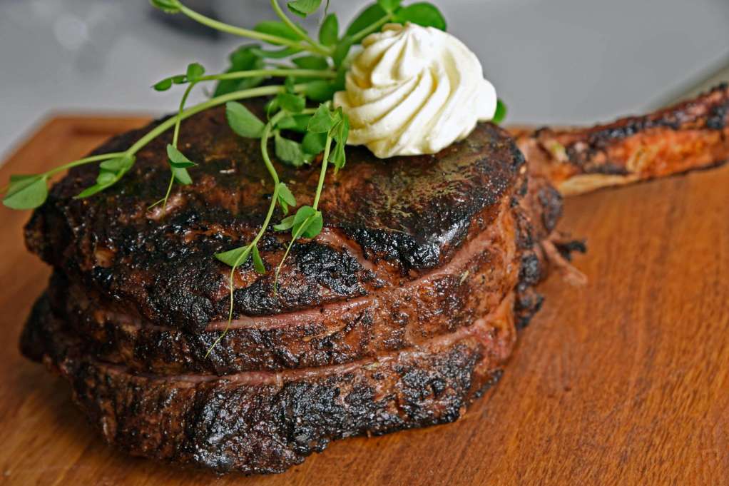 ϾPlated steak on the bone from Brooklyn and the Butcher Restaurant}}