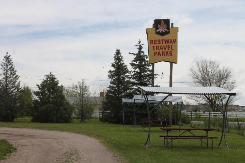 A sign for Restway Travel Parks, a popular RV Camping spot near Cheyenne.