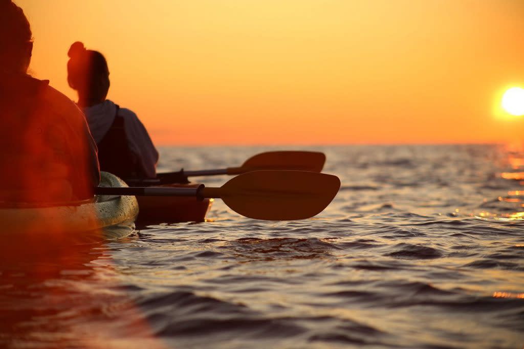Two Kayakers Resting to Watch the Sunset Off Mackinac Island 
