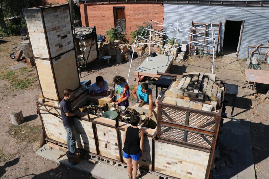 A group of artists at the Clay Center in Greeley works on their pottery