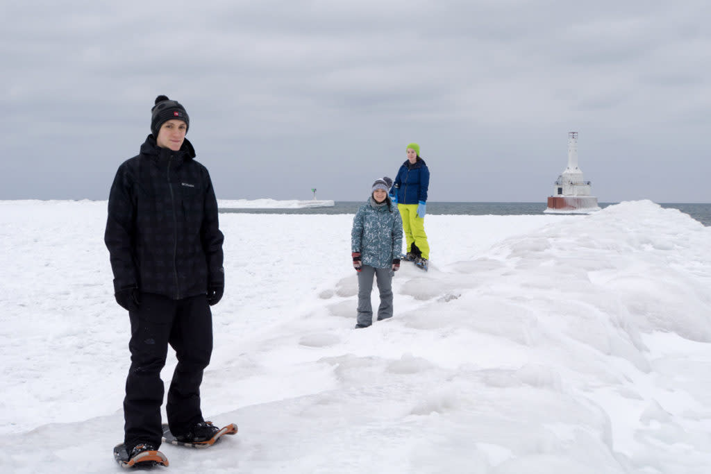 Snowshoers at the Keweenaw Waterway Upper Entrance Light