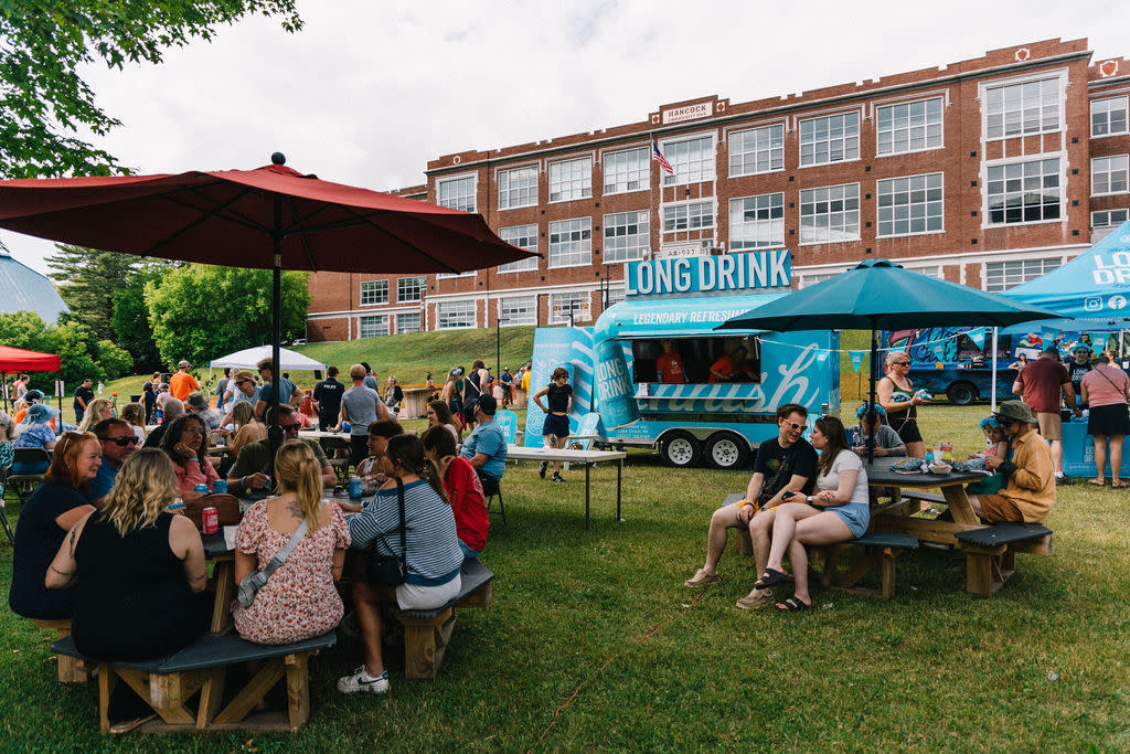 people fill an outdoor seating area