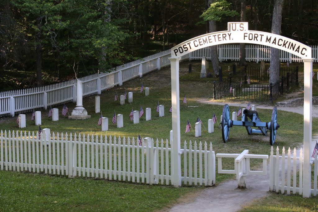 A cannon stands guard inside the Fort Mackinac Post Cemetery on Michigan’s Mackinac Island.