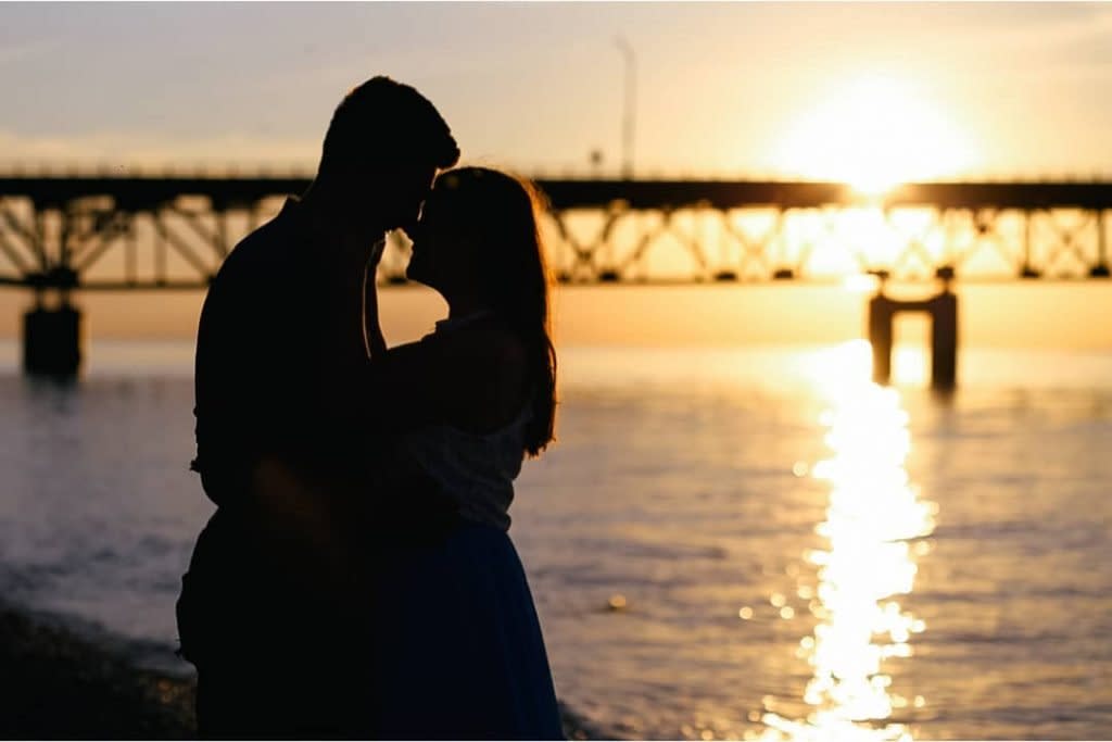 Couple Holding Each Other Next to Shore During Sunset on Mackinac Island