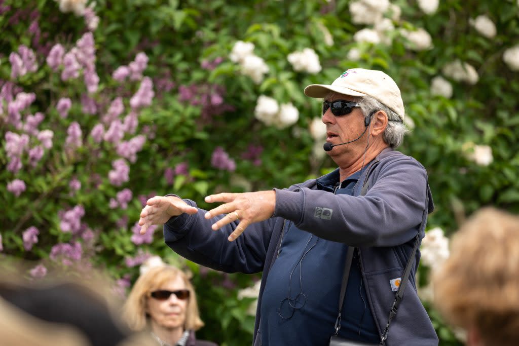 A horticulturist talks about lilacs during one of the many events that are part of the Mackinac Island Lilac Festival 