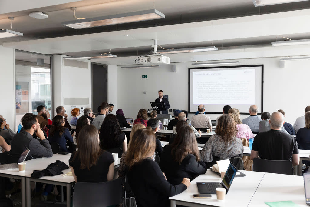 a university classroom hosts an academic conference