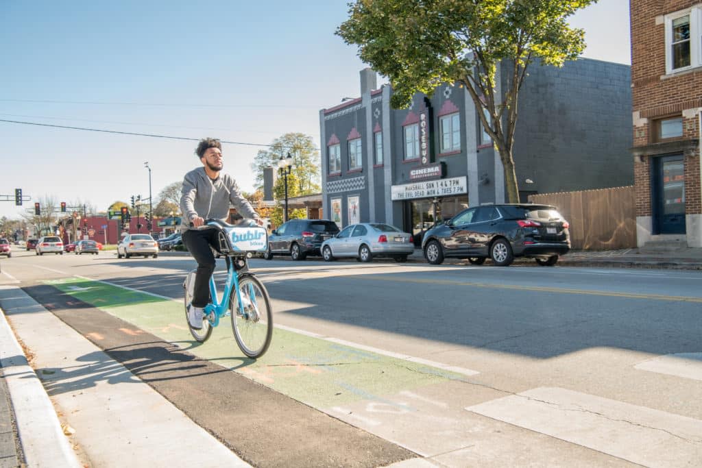 Person on a Bublr Bike riding in the bike lane in Wauwatosa, WI