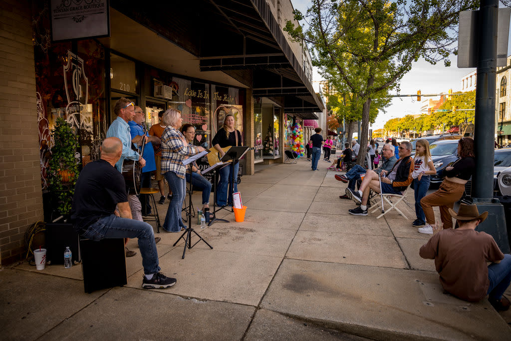 Band playing and crowd watching at Buskers' Bash in Downtown Salisbury
