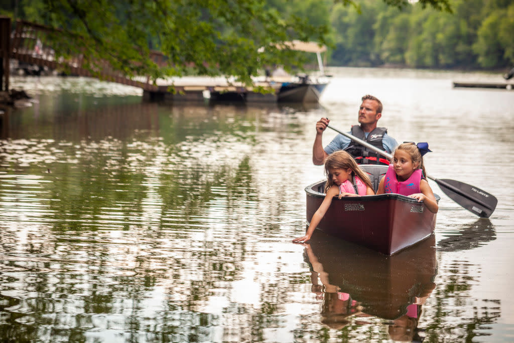 Family in canoe on lake