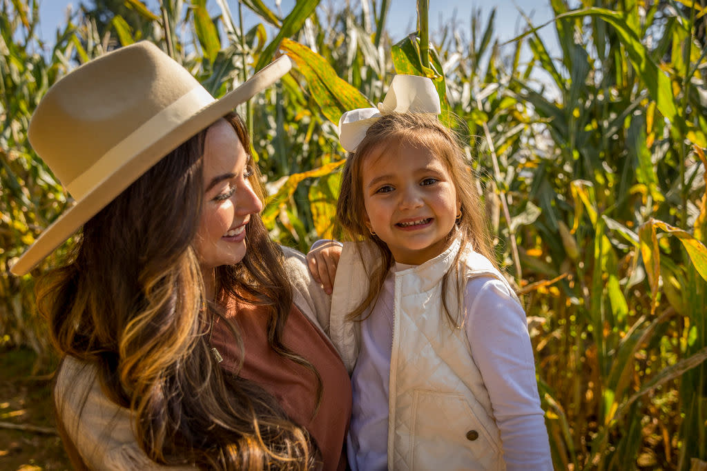 Mom and daugther in corn maze