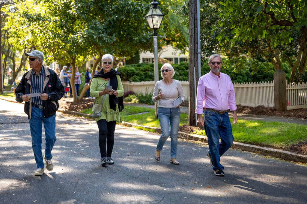 Group of people walking down street