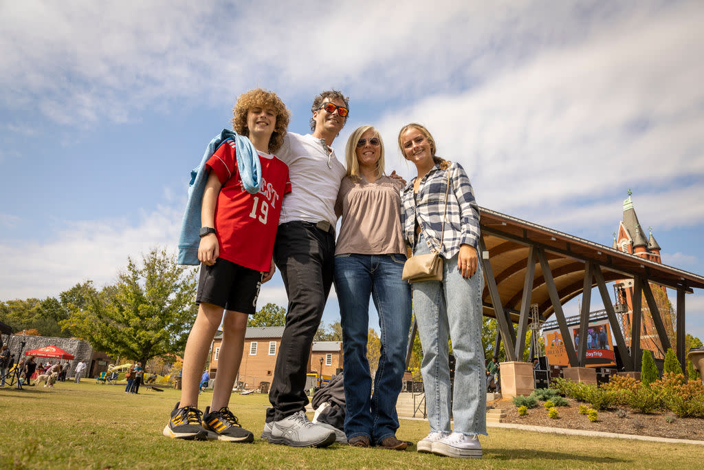 Family in front of ampitheatre in park