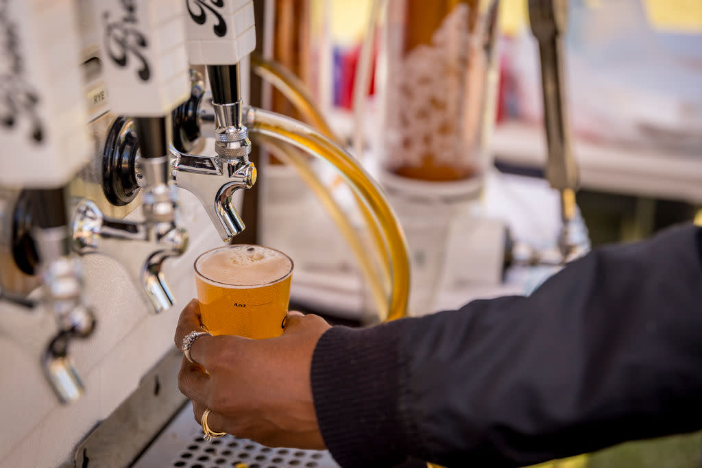 Bartender pouring beer from beer tap