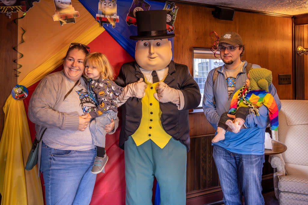 Family taking photos with Sir Topham Hat