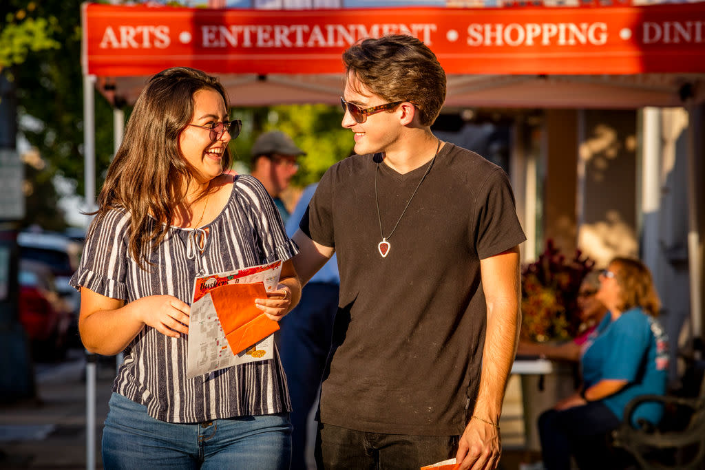 Couple walking in Downtown Salisbury during Buskers' Bash
