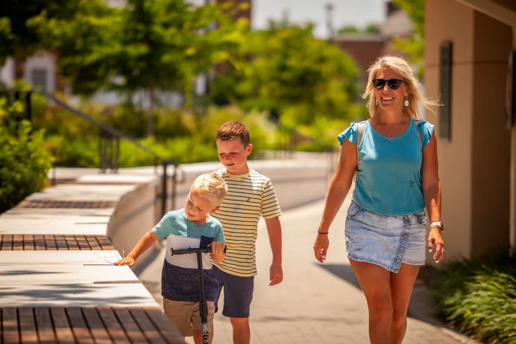 Woman and children walking in Downtown Kannapolis