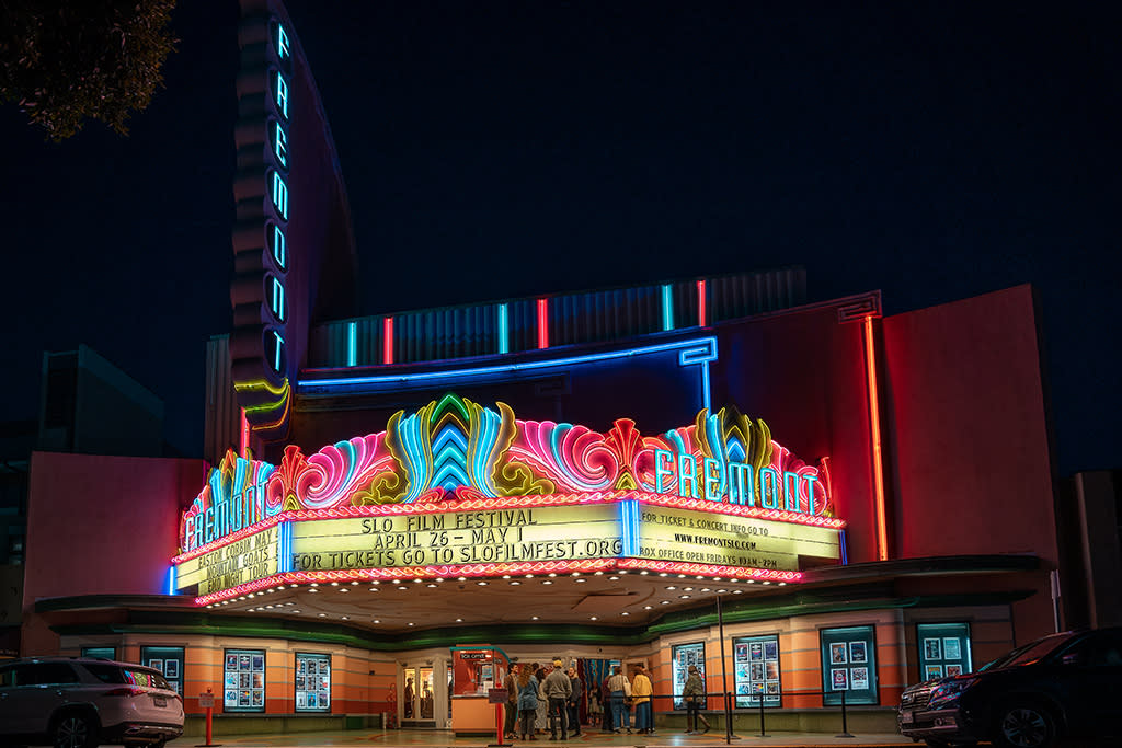Exterior of Fremont Theater with marque lights on